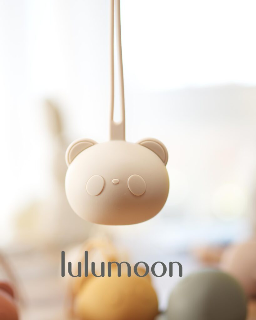 Guardachupete de silicona Lulumoon, fácil de lavar, con enganche para carrito o bolso.